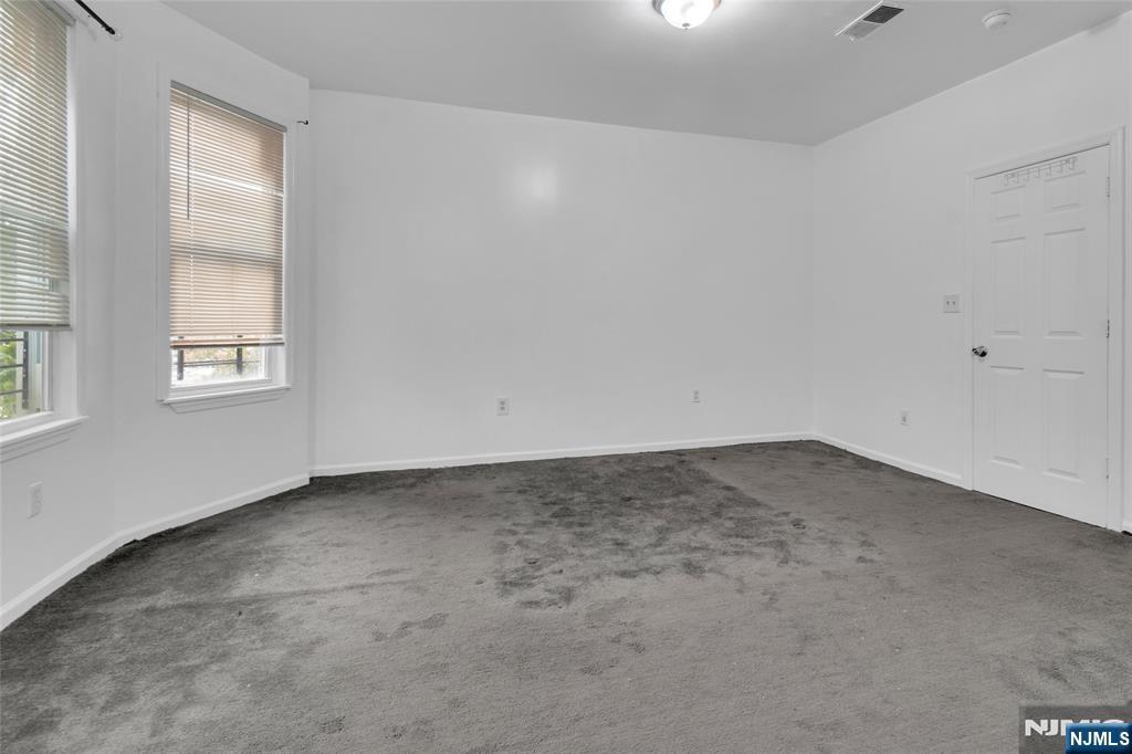 54 3rd Street, Unit 3 Newark, NJ 07107 - Photo 11 of 15 an empty room with a window