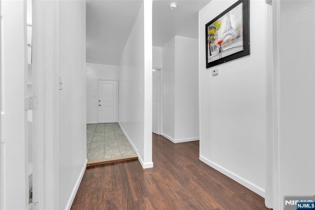 54 3rd Street, Unit 3 Newark, NJ 07107 - Photo 7 of 15 a view of a hallway with wooden floor and closet