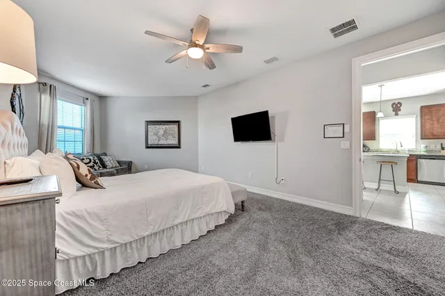 a spacious bathroom with a granite countertop sink mirror and bathtub