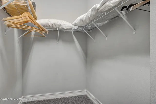 a view of a balcony with furniture