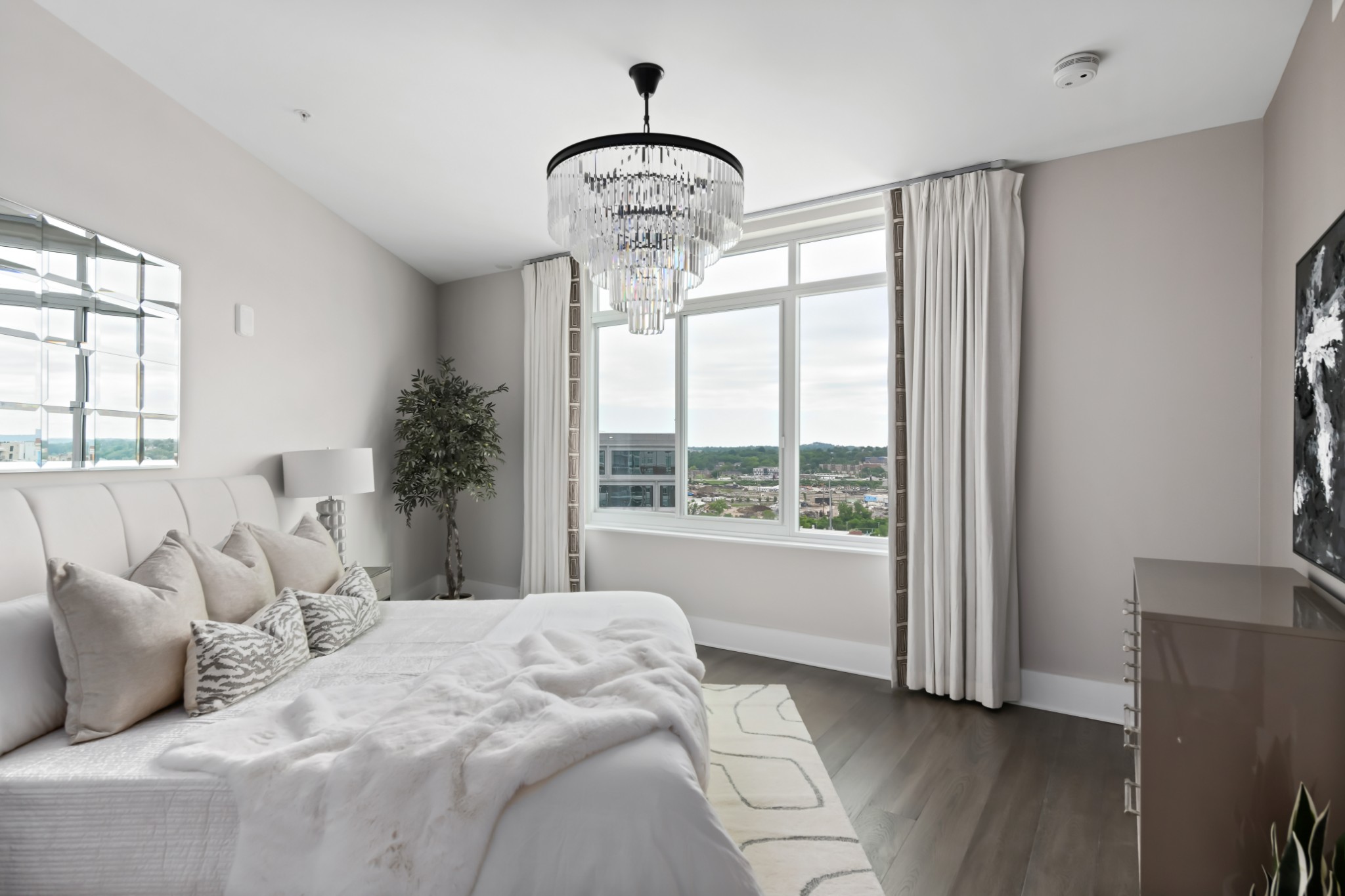 20 Rutledge Street, Unit 707 Nashville, TN 37210 - Photo 11 of 51 a bedroom with a large bed and a window
