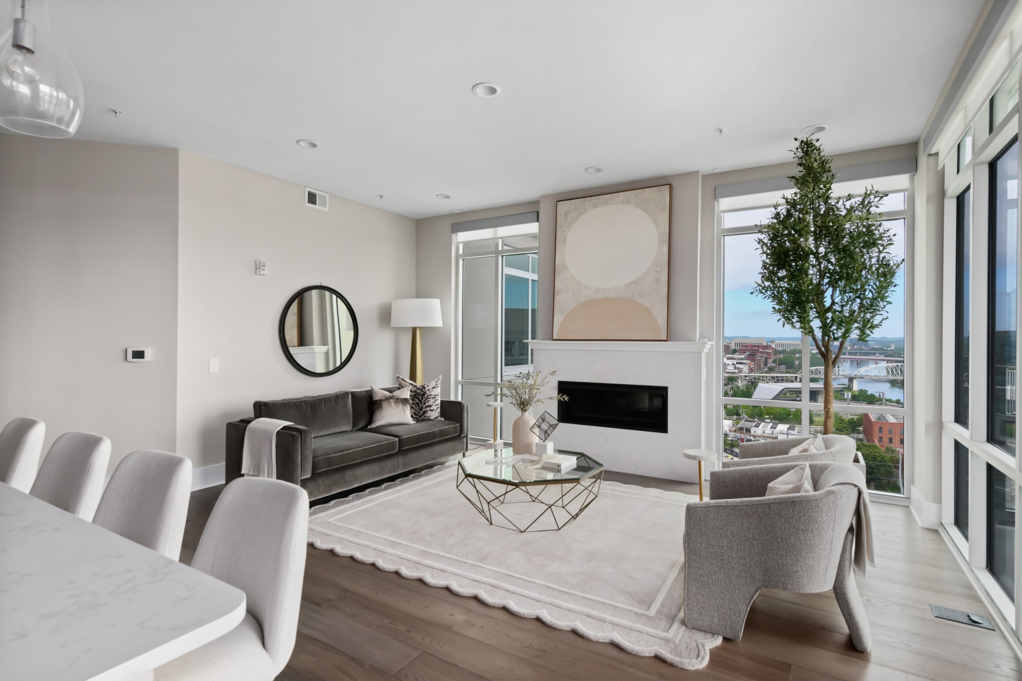 20 Rutledge Street, Unit 707 Nashville, TN 37210 - Photo 2 of 51 a living room with furniture a fireplace and a large window