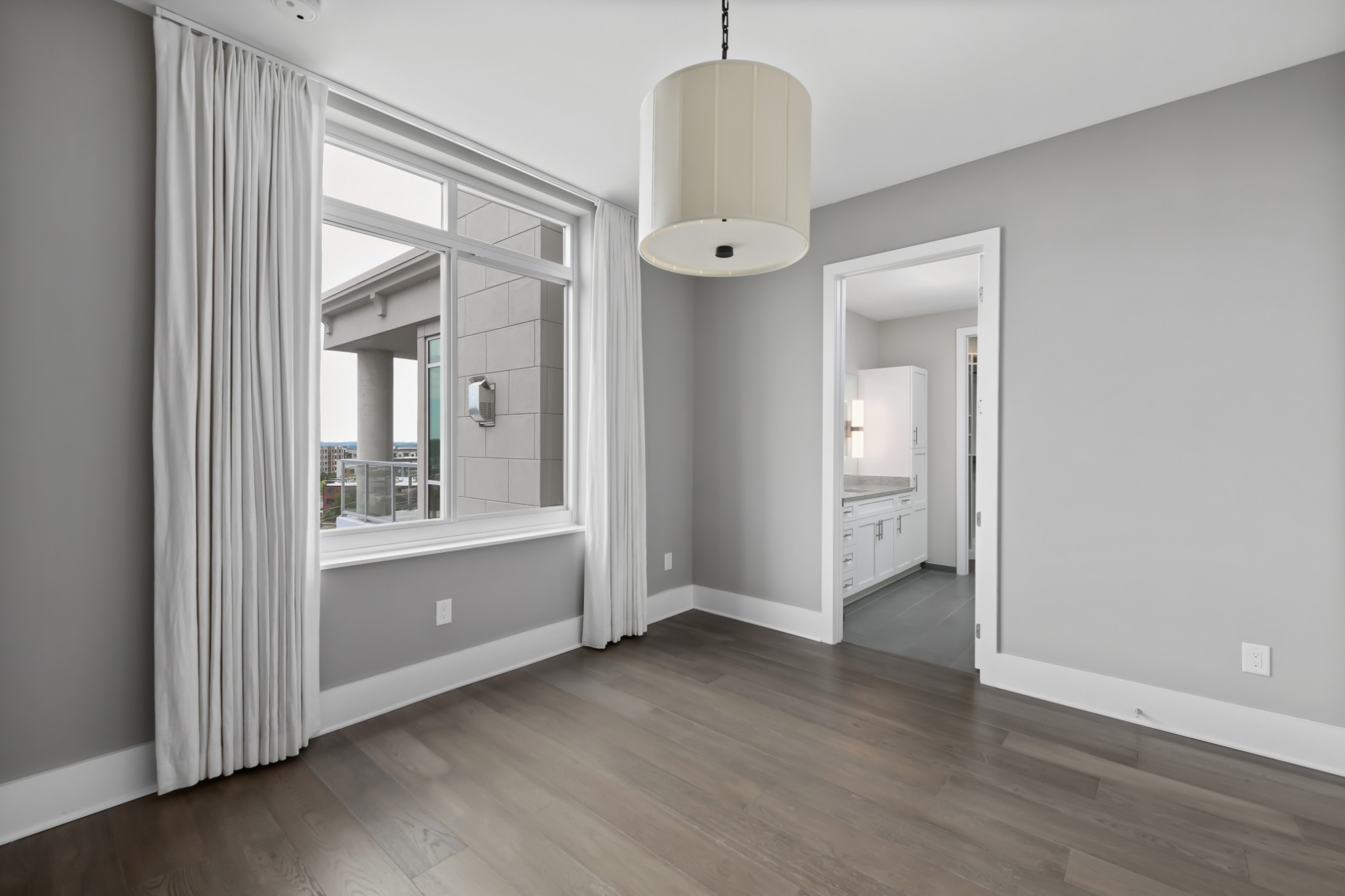 20 Rutledge Street, Unit 707 Nashville, TN 37210 - Photo 25 of 51 a view of a room with wooden floor mirror and windows