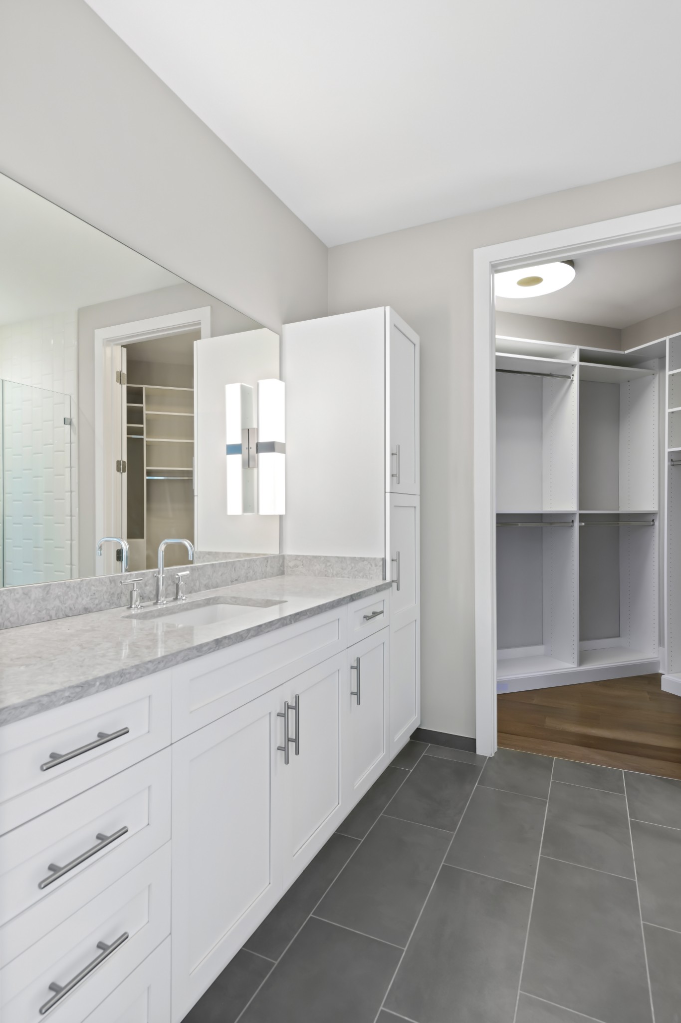 20 Rutledge Street, Unit 707 Nashville, TN 37210 - Photo 26 of 51 a bathroom with a granite countertop sink and a mirror