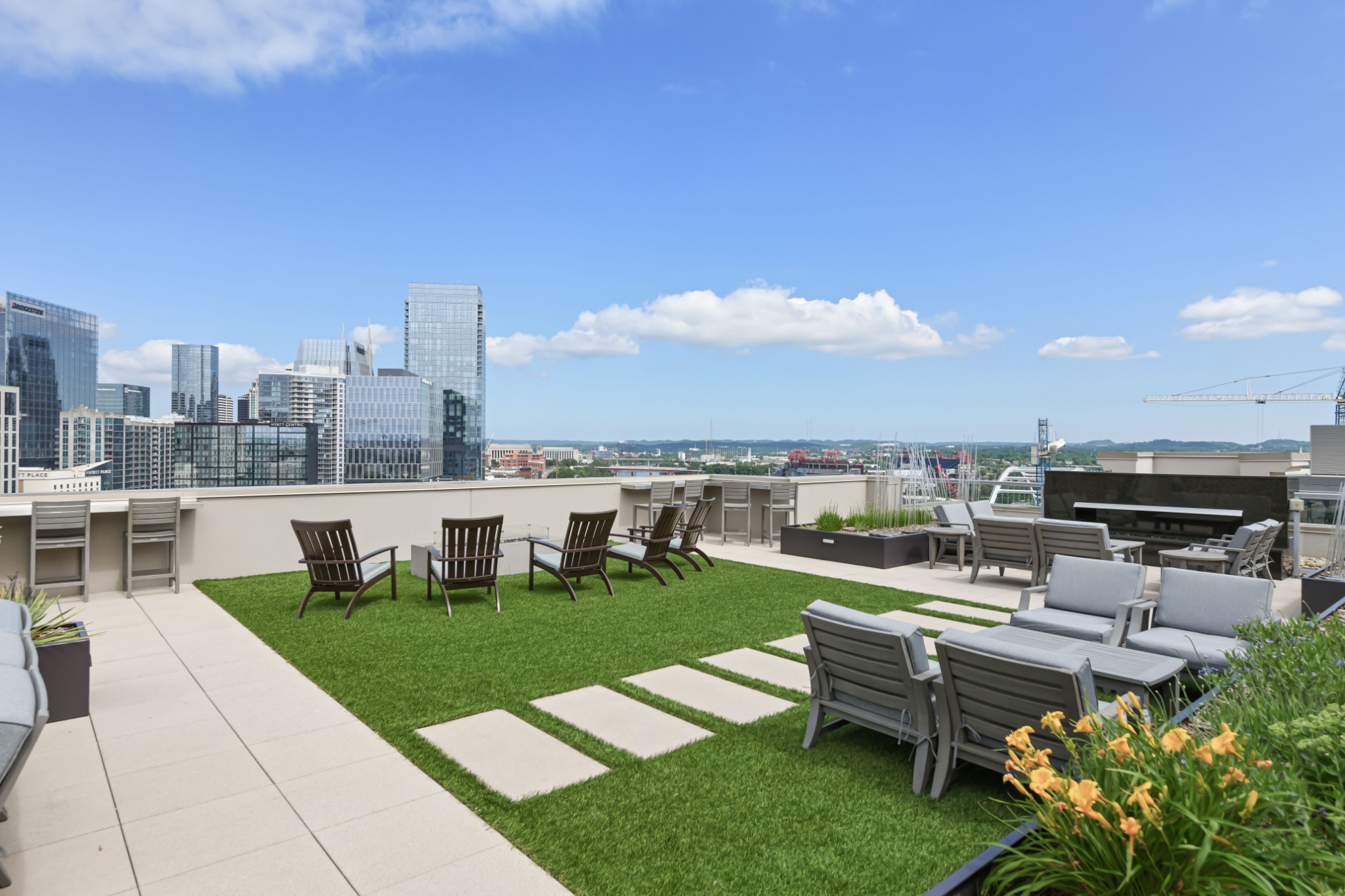 20 Rutledge Street, Unit 707 Nashville, TN 37210 - Photo 35 of 51 a view of a patio with couches potted plants and a big yard