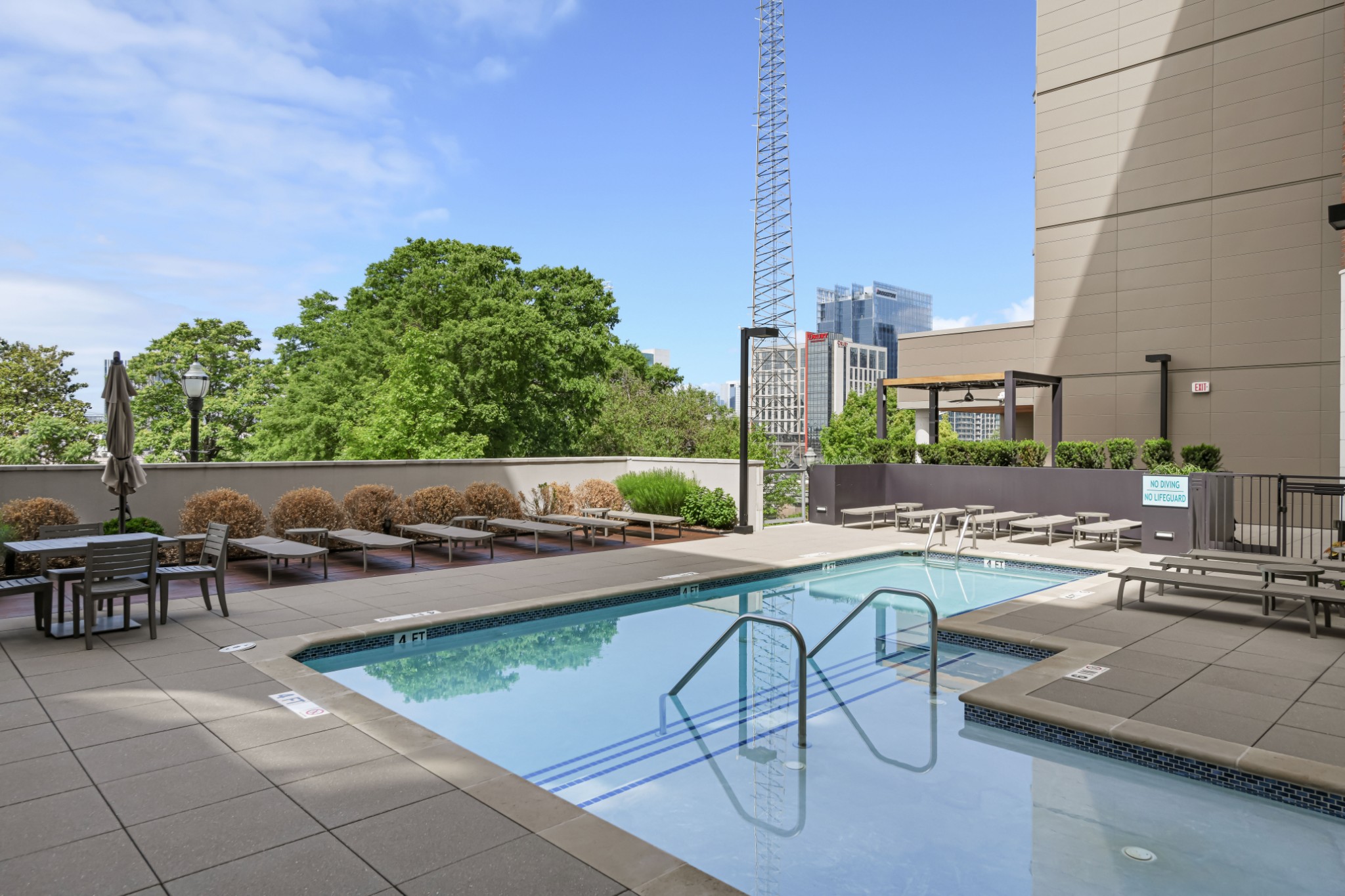20 Rutledge Street, Unit 707 Nashville, TN 37210 - Photo 39 of 51 a view of a swimming pool with outdoor seating and plants