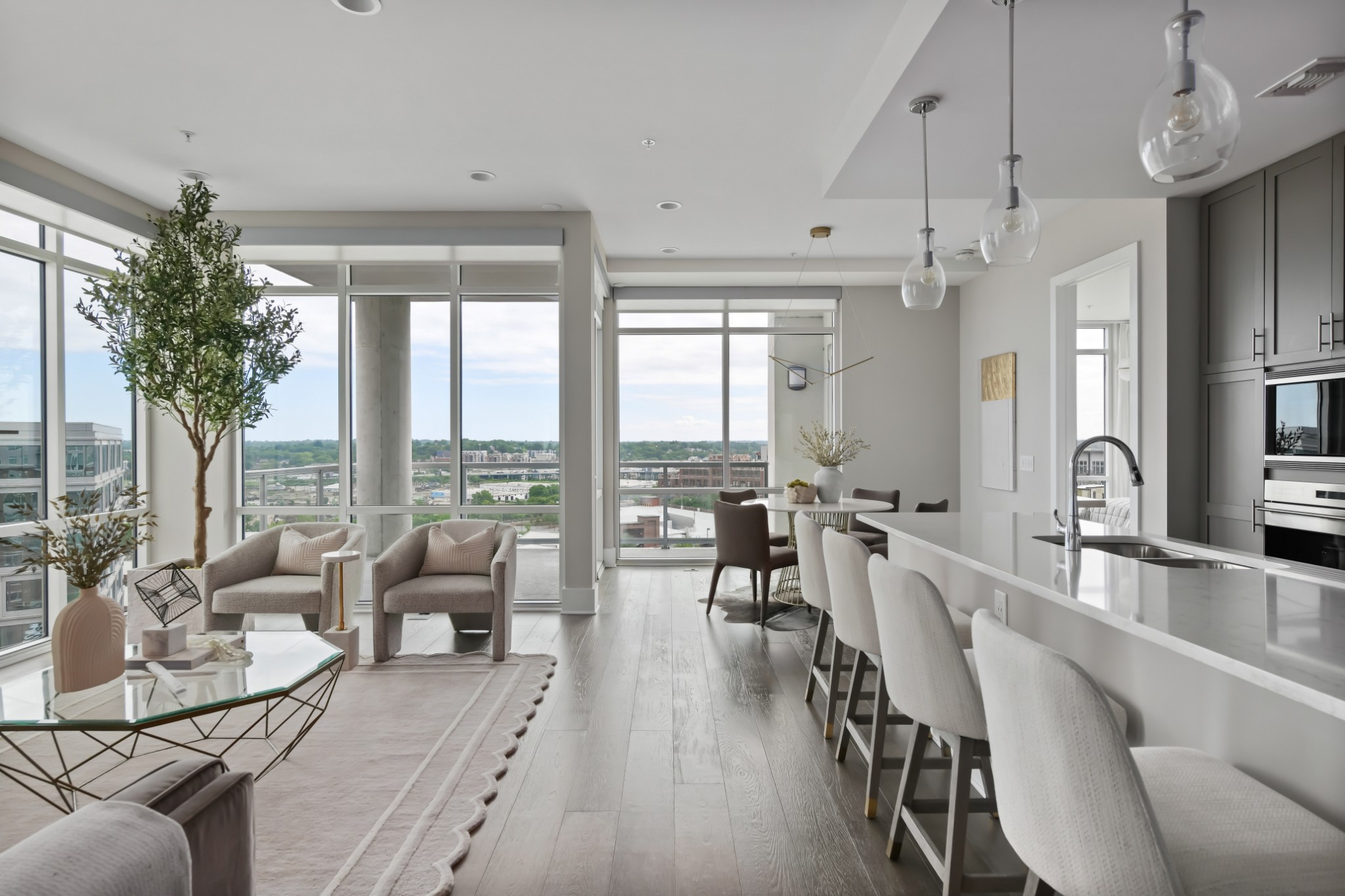 20 Rutledge Street, Unit 707 Nashville, TN 37210 - Photo 4 of 51 a very nice looking living room with a large window and dining table