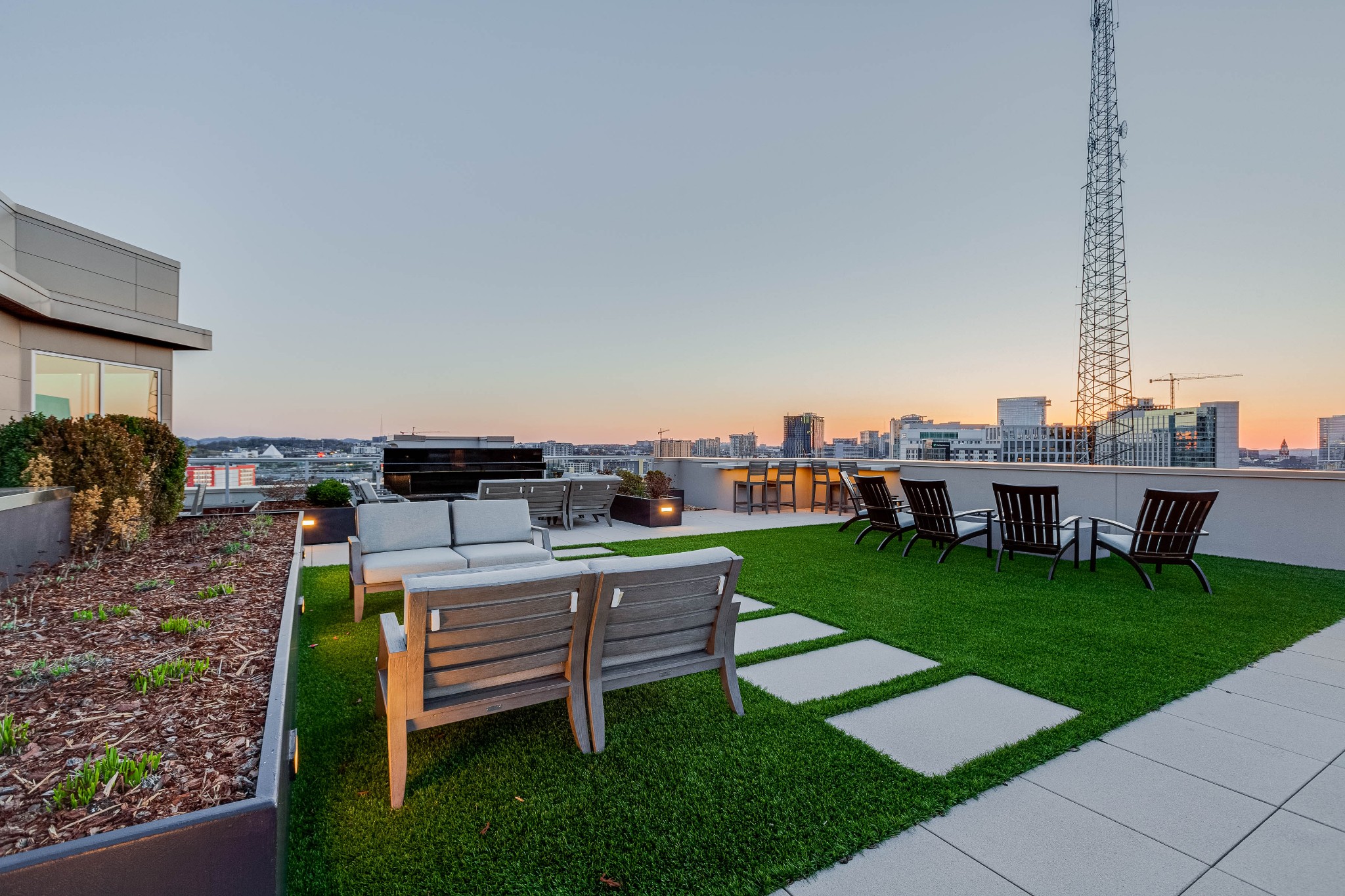 20 Rutledge Street, Unit 707 Nashville, TN 37210 - Photo 44 of 51 a backyard view of a house with a garden and plants