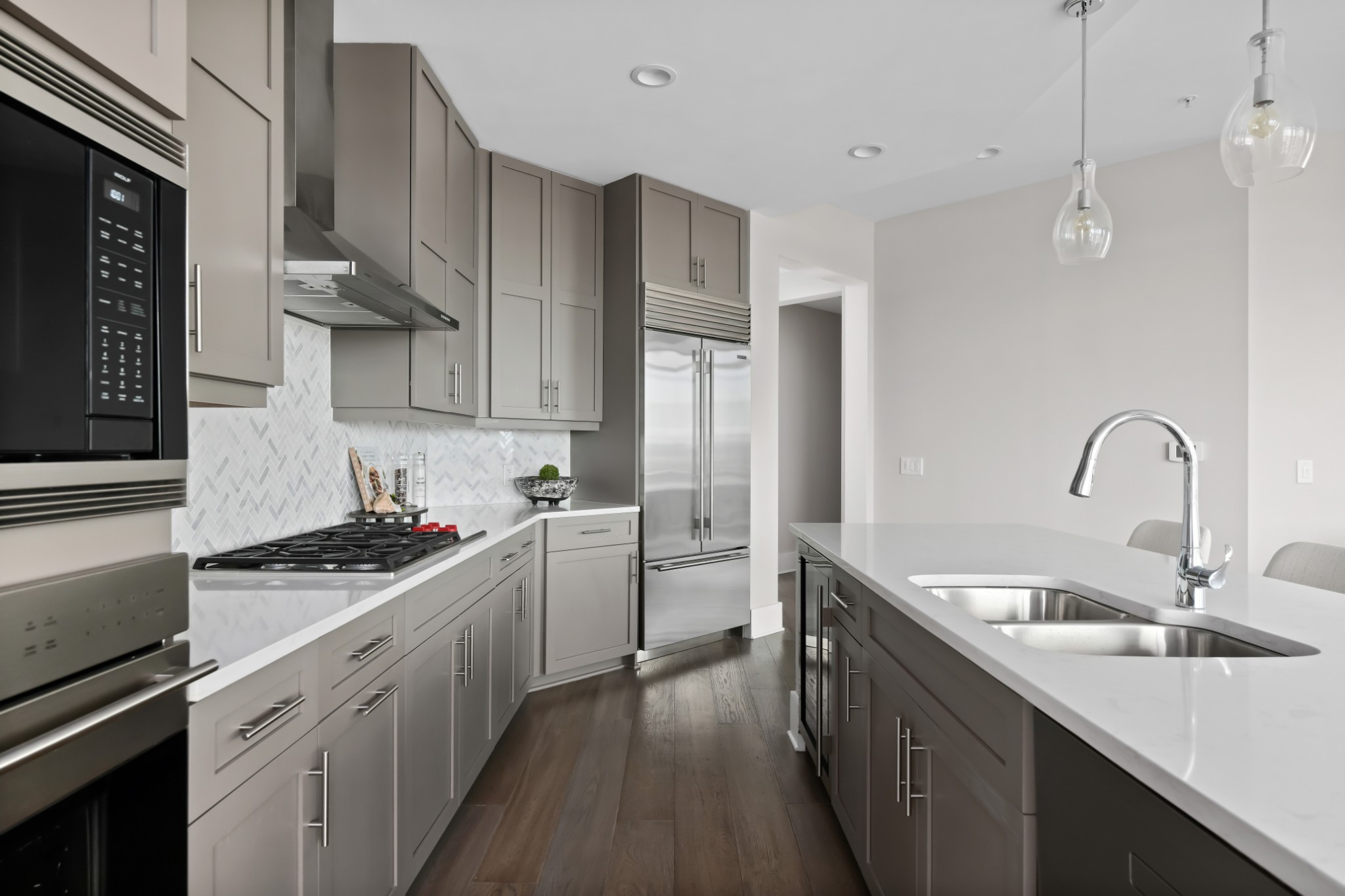 20 Rutledge Street, Unit 707 Nashville, TN 37210 - Photo 7 of 51 a kitchen with sink a stove and cabinets