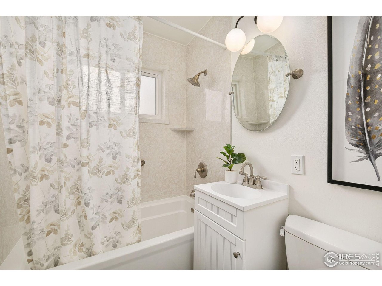 533 Crestmore Place Fort Collins, CO 80521 - Photo 12 of 19 a bathroom with a sink vanity mirror and toilet