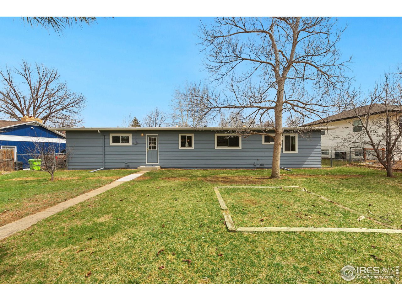 533 Crestmore Place Fort Collins, CO 80521 - Photo 18 of 19 a view of a house with a backyard