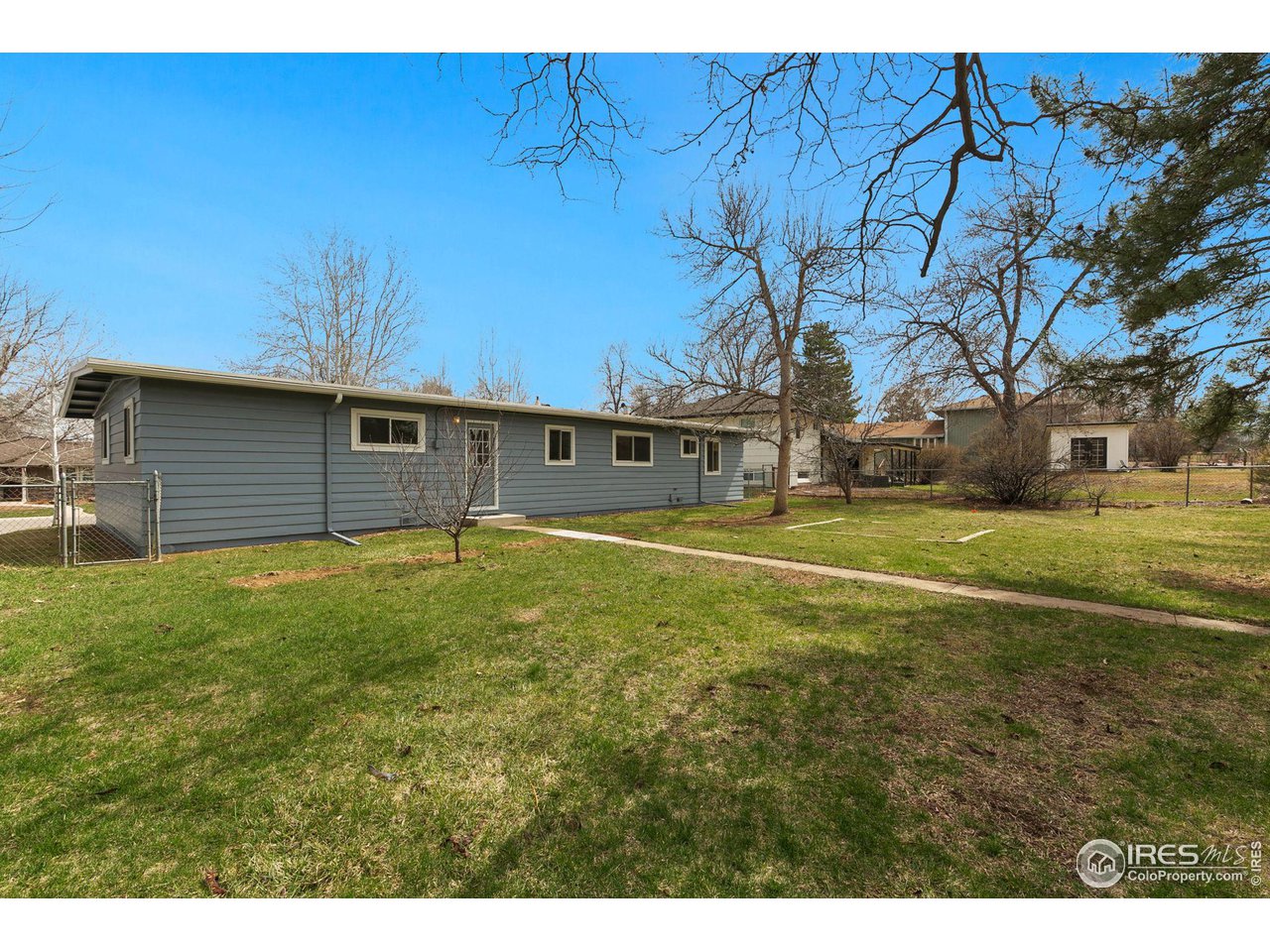 533 Crestmore Place Fort Collins, CO 80521 - Photo 19 of 19 a view of a backyard with large trees