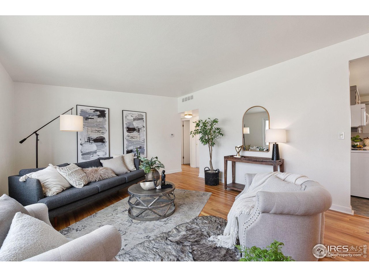 533 Crestmore Place Fort Collins, CO 80521 - Photo 3 of 19 a living room with furniture and a wooden floor