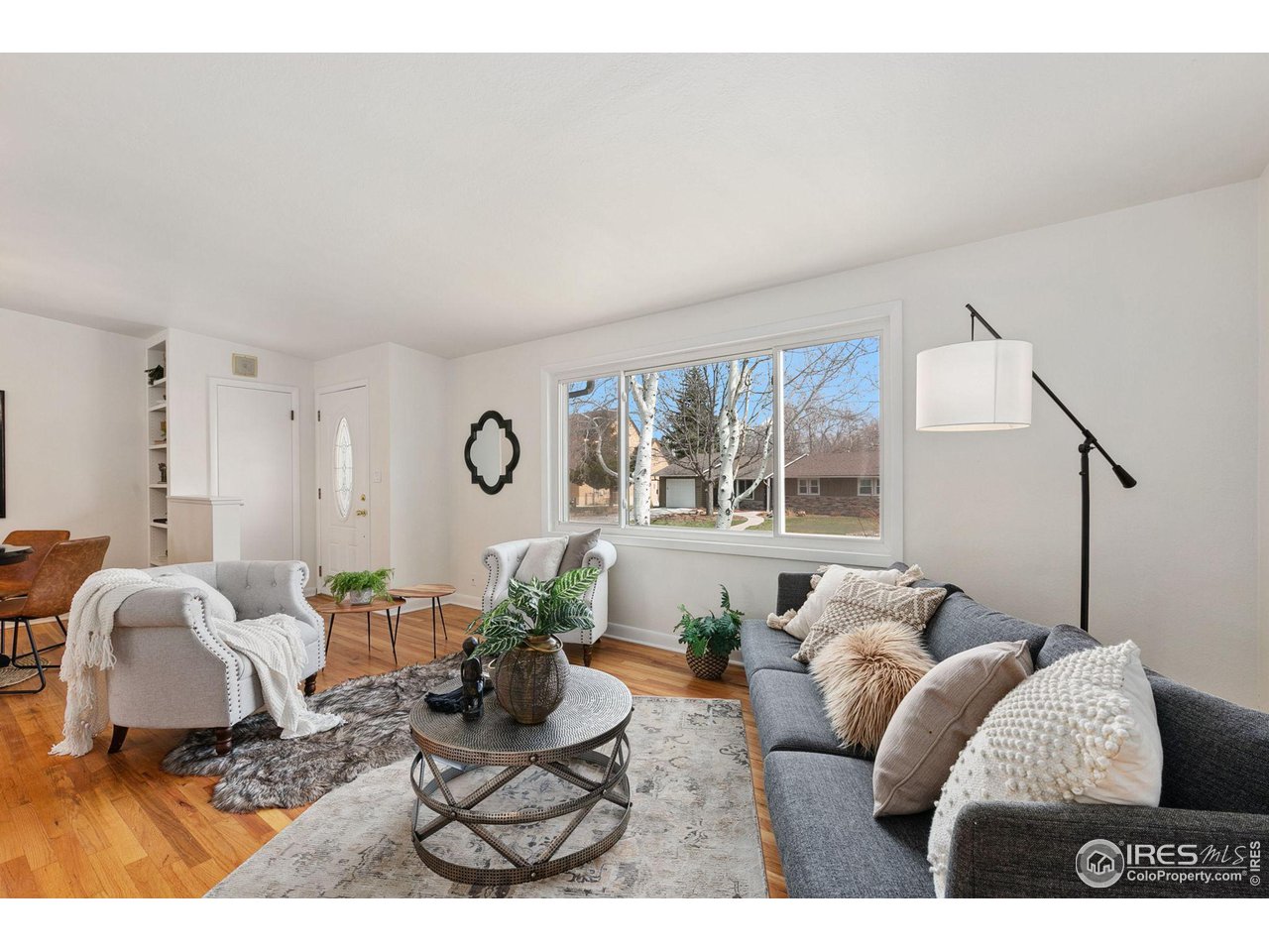 533 Crestmore Place Fort Collins, CO 80521 - Photo 4 of 19 a living room with furniture and window