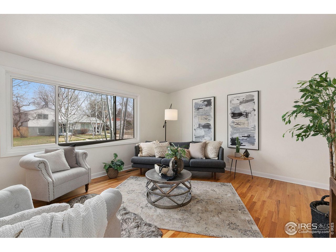 533 Crestmore Place Fort Collins, CO 80521 - Photo 5 of 19 a living room with furniture or couch and a large window