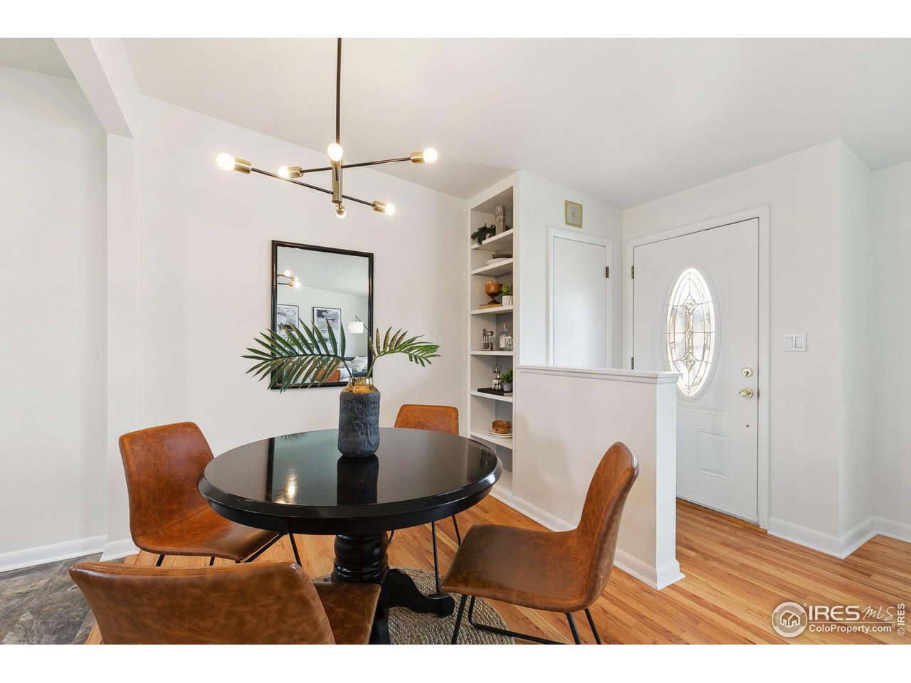 533 Crestmore Place Fort Collins, CO 80521 - Photo 6 of 19 a view of a dining room with furniture and wooden floor