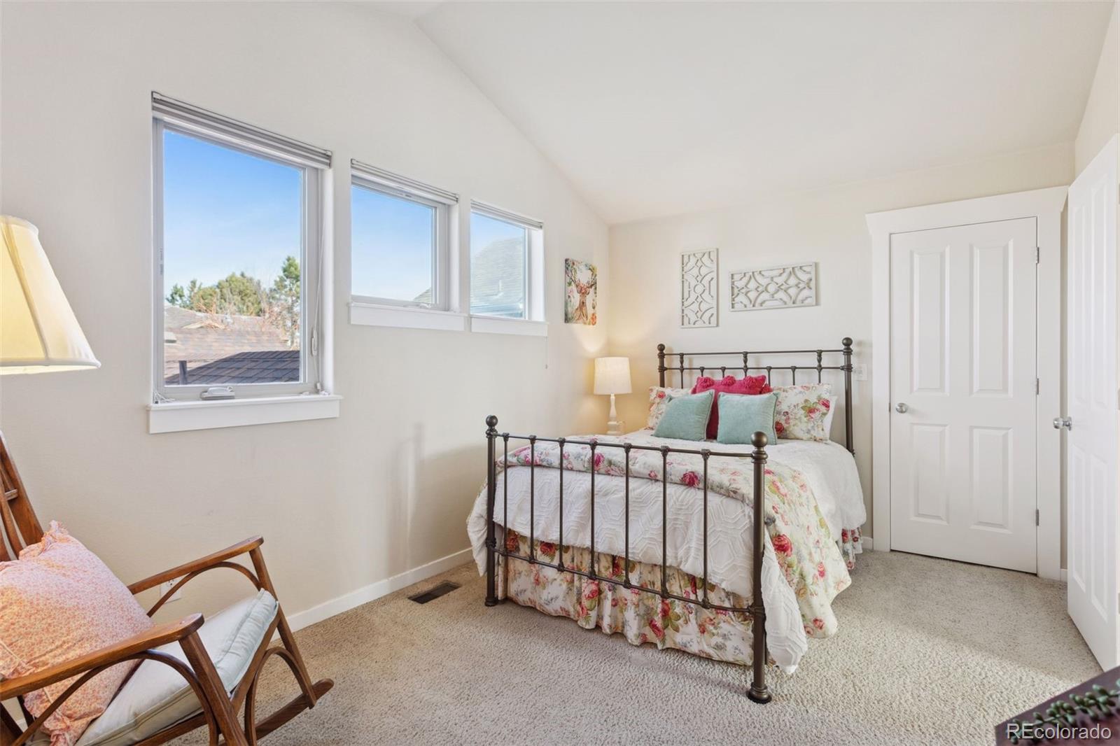 2882 Alton Street Denver, CO 80238 - Photo 20 of 42 a bedroom with a bed and a window