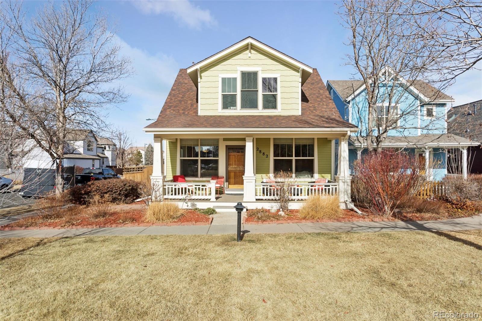 2882 Alton Street Denver, CO 80238 - Photo 2 of 42 a front view of a house with a yard covered in snow