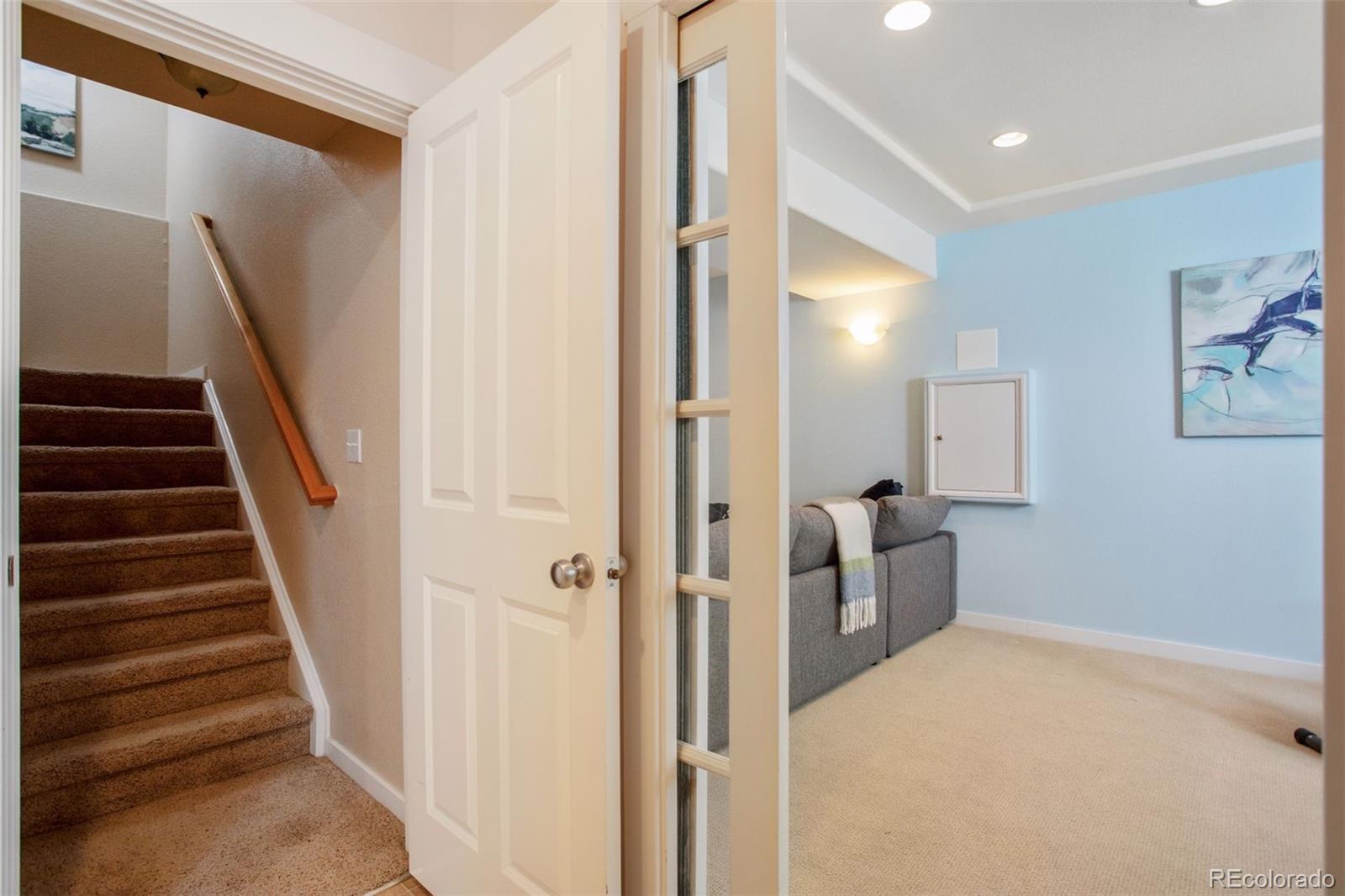 2882 Alton Street Denver, CO 80238 - Photo 26 of 42 a view of a hallway with paintings on the walls