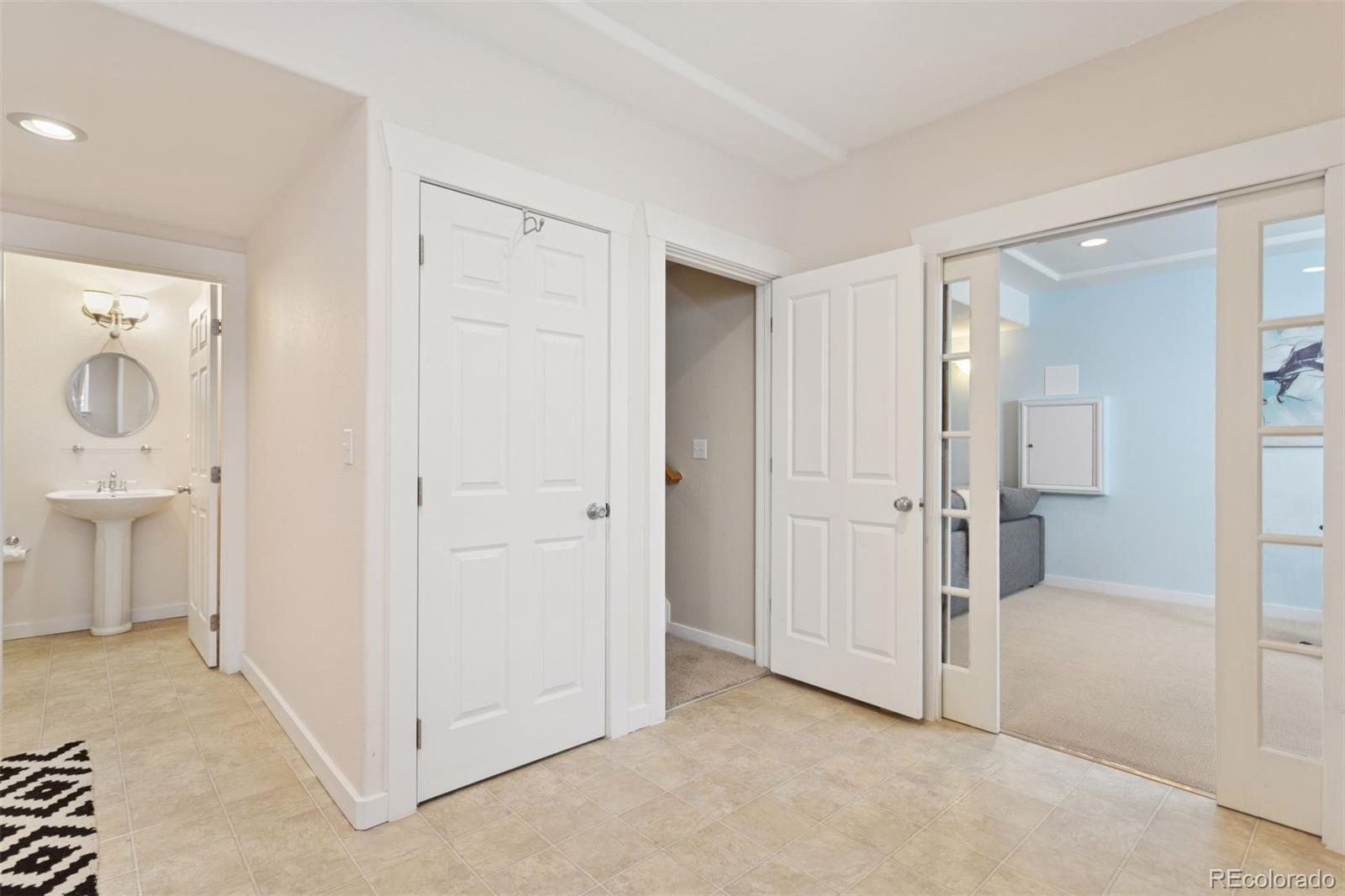 2882 Alton Street Denver, CO 80238 - Photo 28 of 42 a view of a bathroom with a shower and a sink