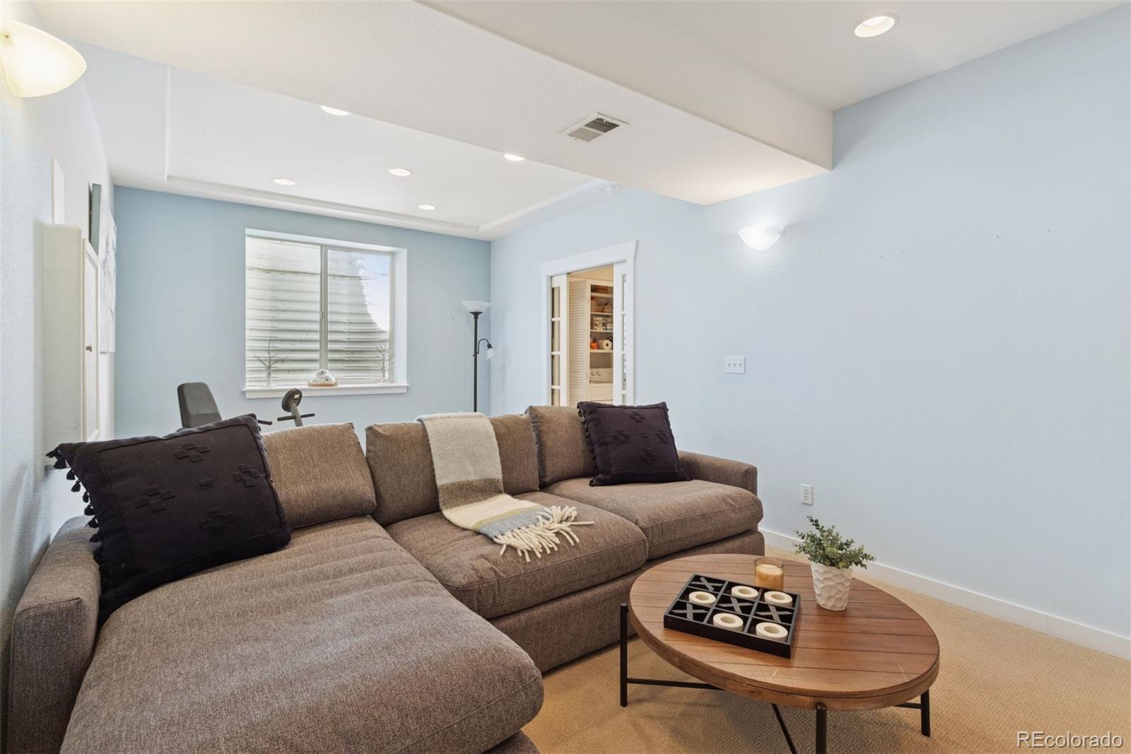 2882 Alton Street Denver, CO 80238 - Photo 31 of 42 a living room with furniture and a window