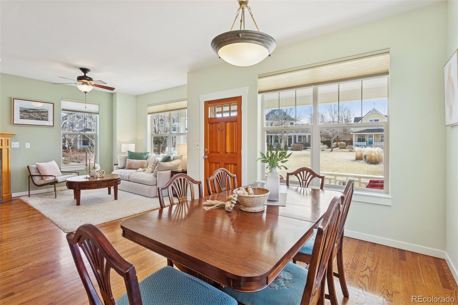 2882 Alton Street Denver, CO 80238 - Photo 4 of 42 a view of a dining room with furniture window and wooden floor