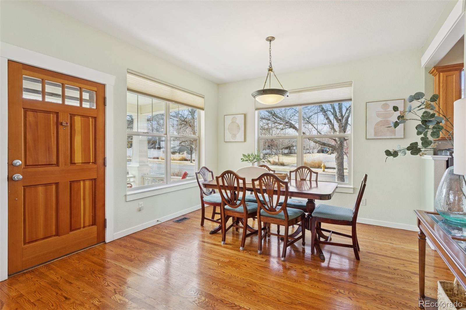 2882 Alton Street Denver, CO 80238 - Photo 6 of 42 a view of a dining room with furniture window and wooden floor