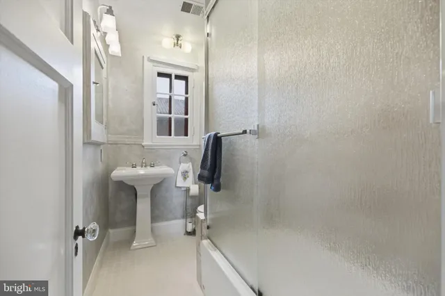 a bathroom with a sink and mirror