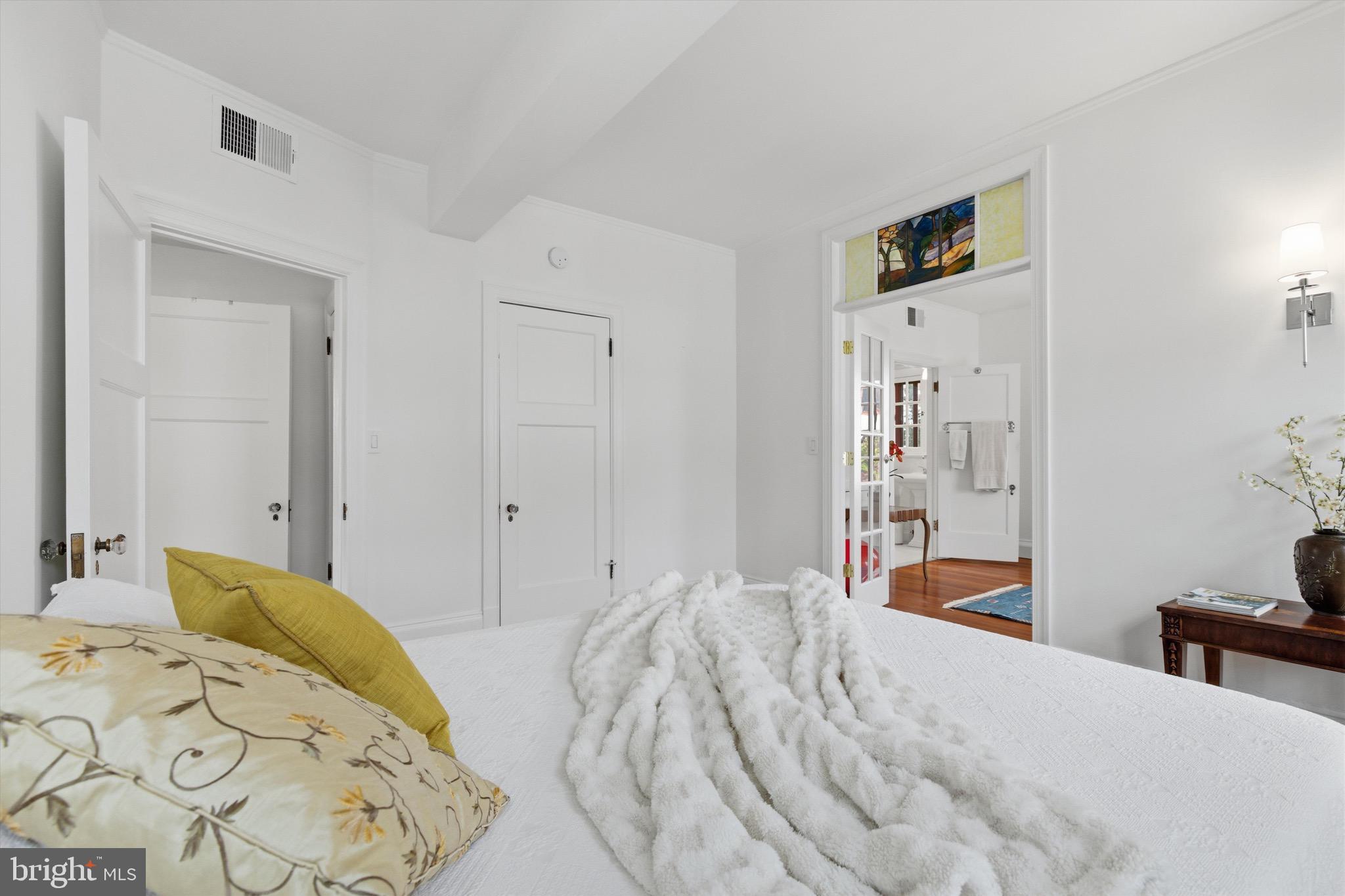 230 Stony Run Lane, Unit 4F Baltimore, MD 21210 - Photo 20 of 24 a bedroom with a bed and a cabinets