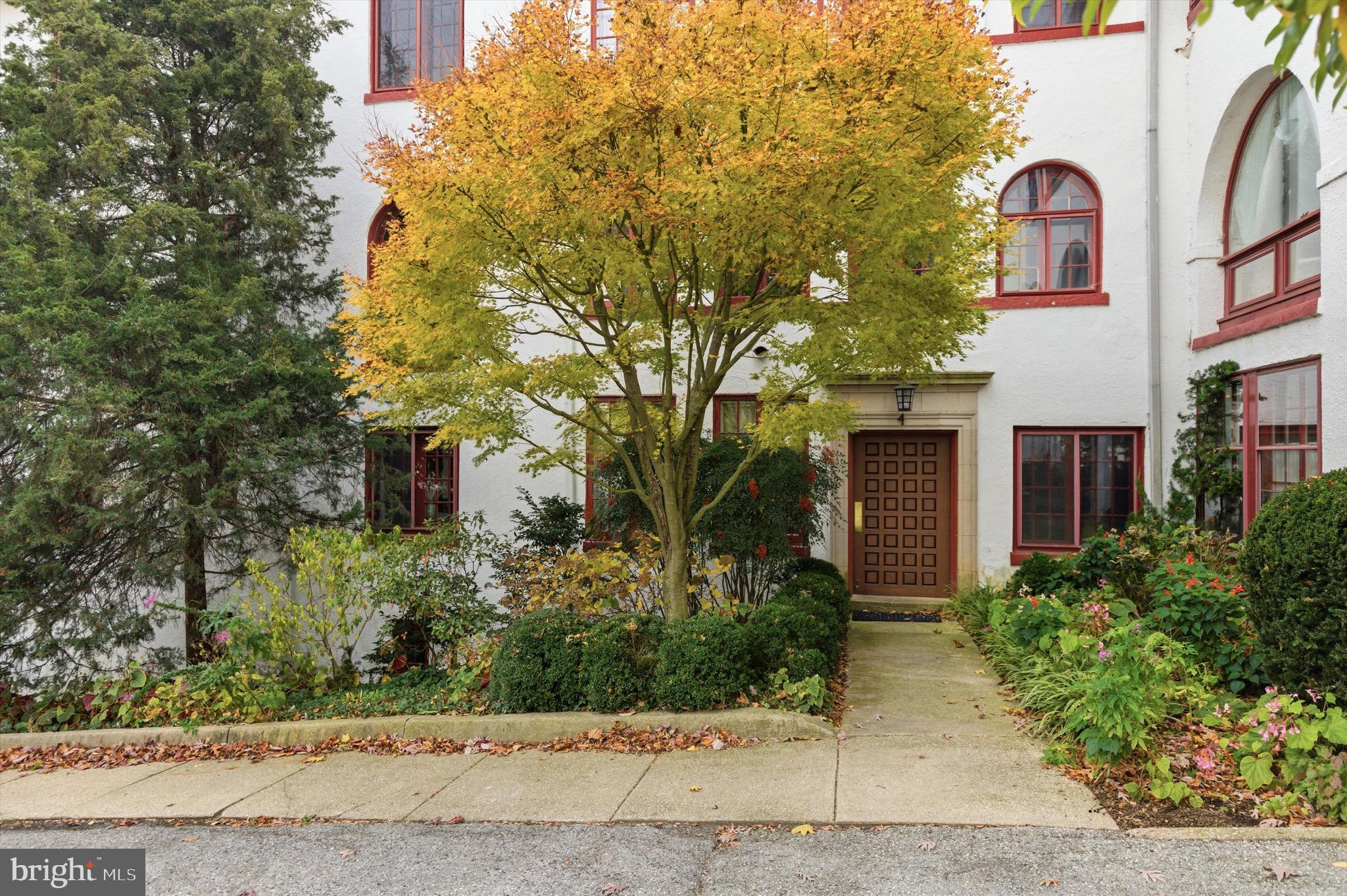 230 Stony Run Lane, Unit 4F Baltimore, MD 21210 - Photo 2 of 24 a front view of a multi story residential apartment building