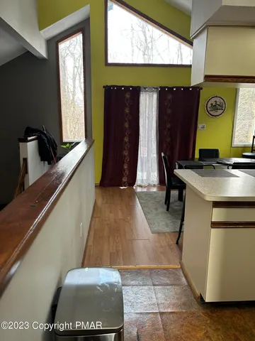 a view of kitchen with furniture and window