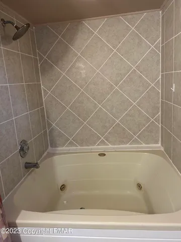 a bathroom with a bathtub