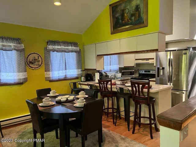 a view of a dining room with furniture