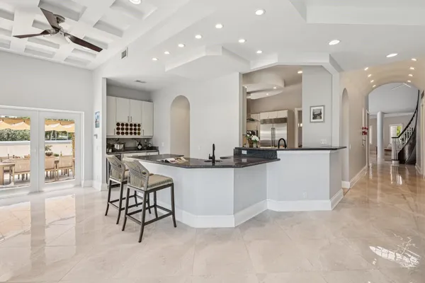 a kitchen with sink cabinets and window
