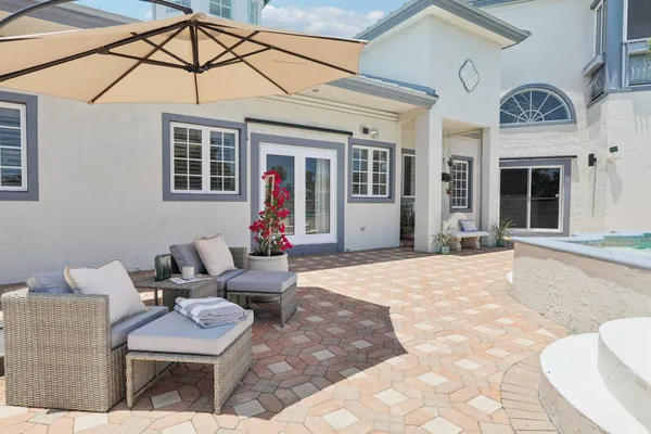 a view of a swimming pool with a yard