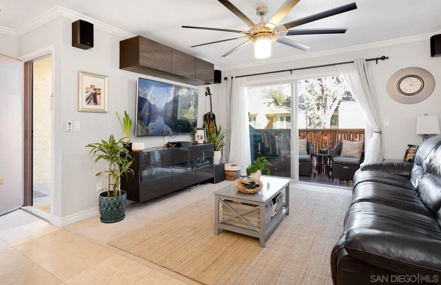 6052 Rancho Mission Road, Unit 408 San Diego, CA 92108 - Photo 1 of 36 a living room with furniture a fireplace and a potted plant
