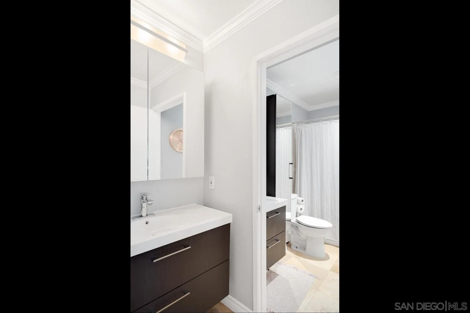 6052 Rancho Mission Road, Unit 408 San Diego, CA 92108 - Photo 11 of 36 a bathroom with a double vanity sink toilet and shower