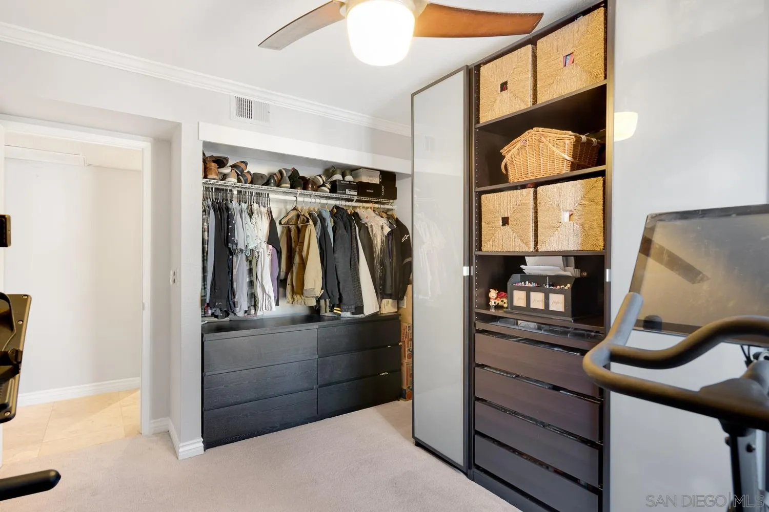 6052 Rancho Mission Road, Unit 408 San Diego, CA 92108 - Photo 13 of 36 a view of walk in closet with clothes and shoes