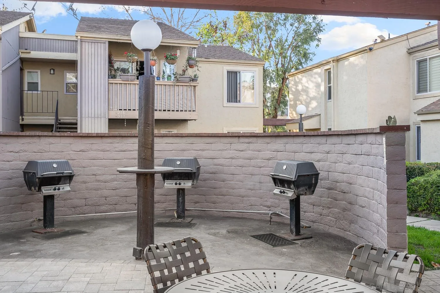 6052 Rancho Mission Road, Unit 408 San Diego, CA 92108 - Photo 24 of 36 a front view of a house with yard