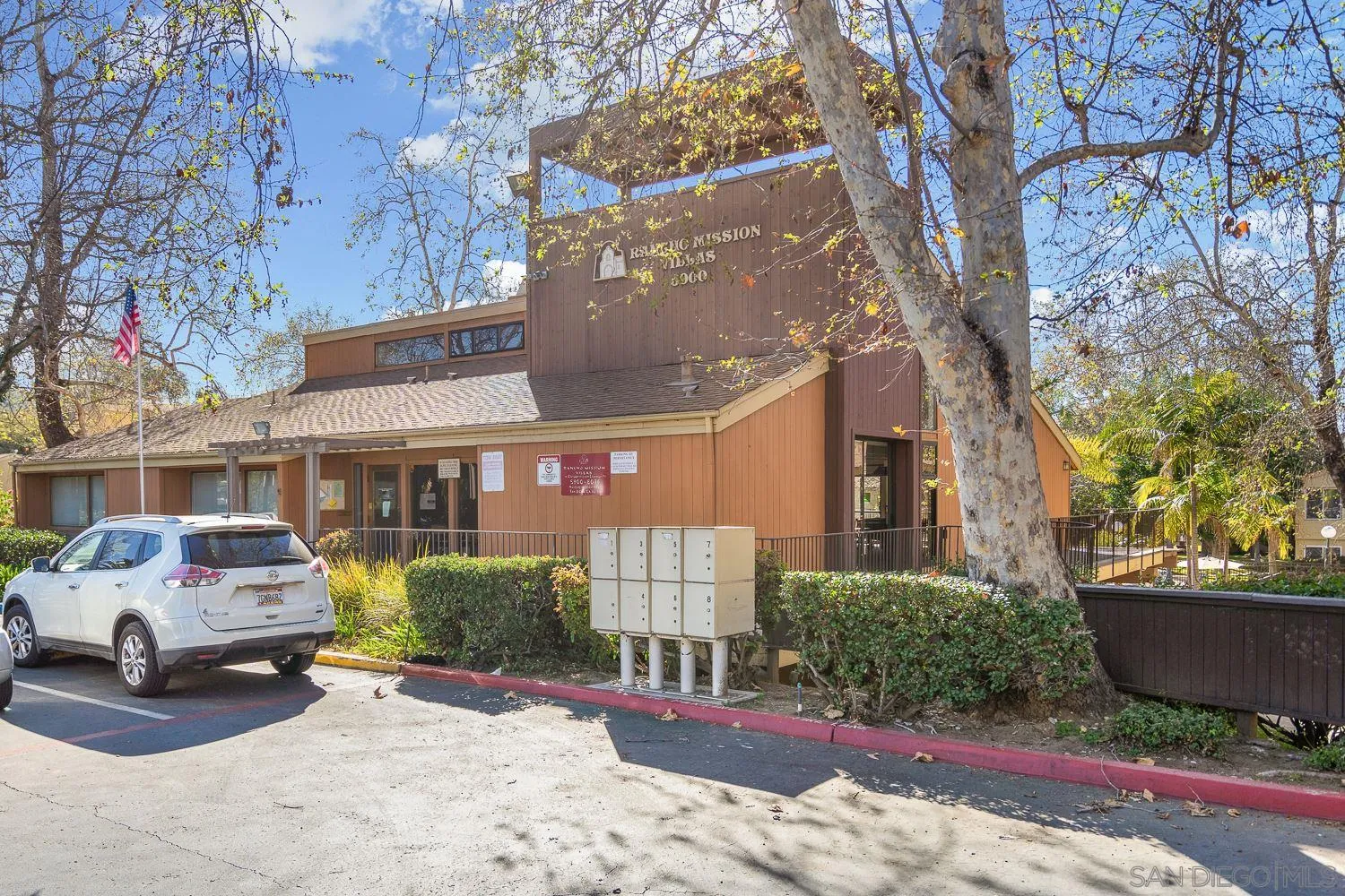 6052 Rancho Mission Road, Unit 408 San Diego, CA 92108 - Photo 29 of 36 a front view of a house with garden