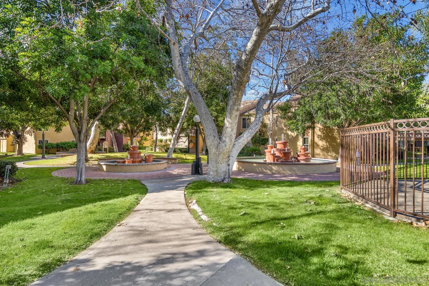 6052 Rancho Mission Road, Unit 408 San Diego, CA 92108 - Photo 31 of 36 a view of a yard with plants and trees