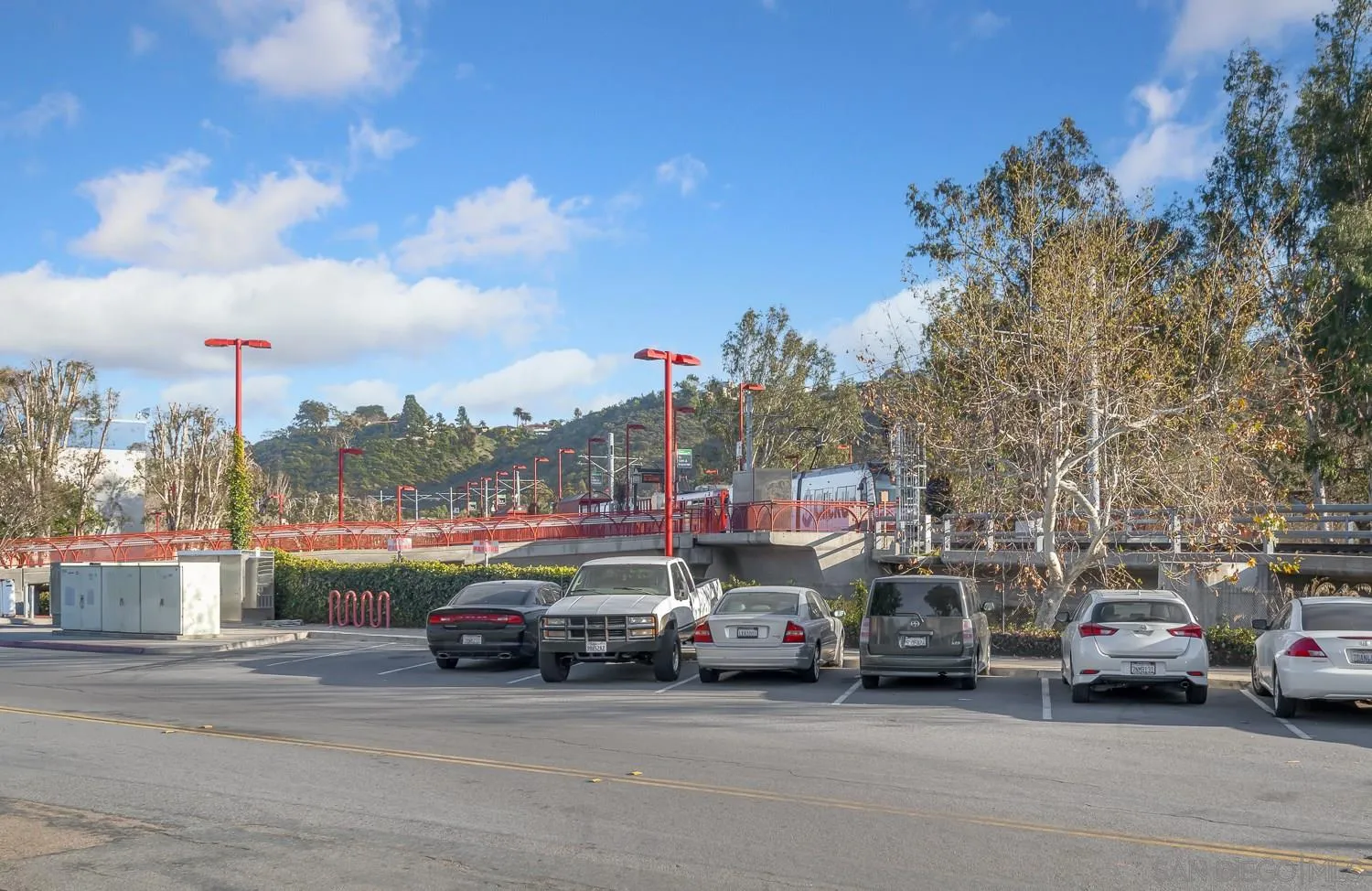 6052 Rancho Mission Road, Unit 408 San Diego, CA 92108 - Photo 35 of 36 a view of cars parked in front of a building