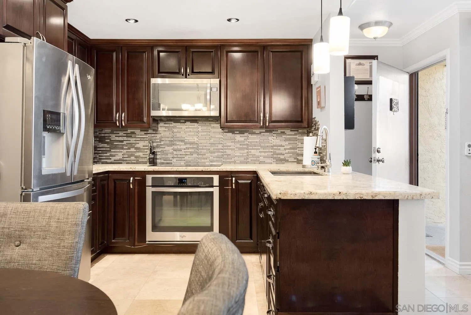 6052 Rancho Mission Road, Unit 408 San Diego, CA 92108 - Photo 4 of 36 a kitchen with a sink stove and refrigerator