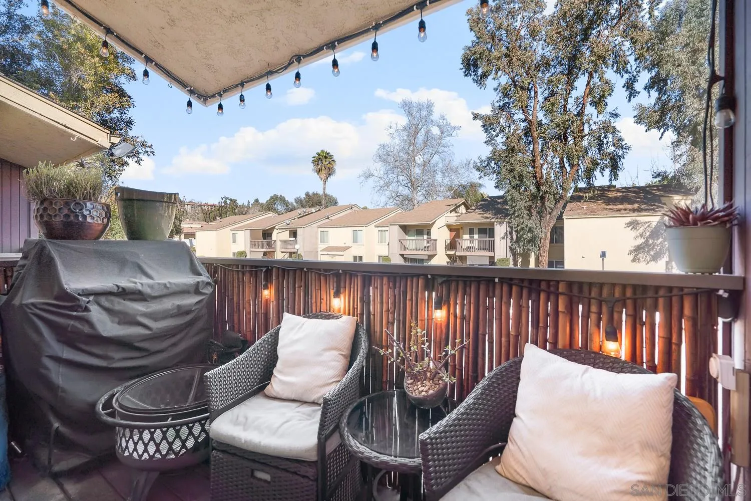 6052 Rancho Mission Road, Unit 408 San Diego, CA 92108 - Photo 7 of 36 a view of a balcony with furniture