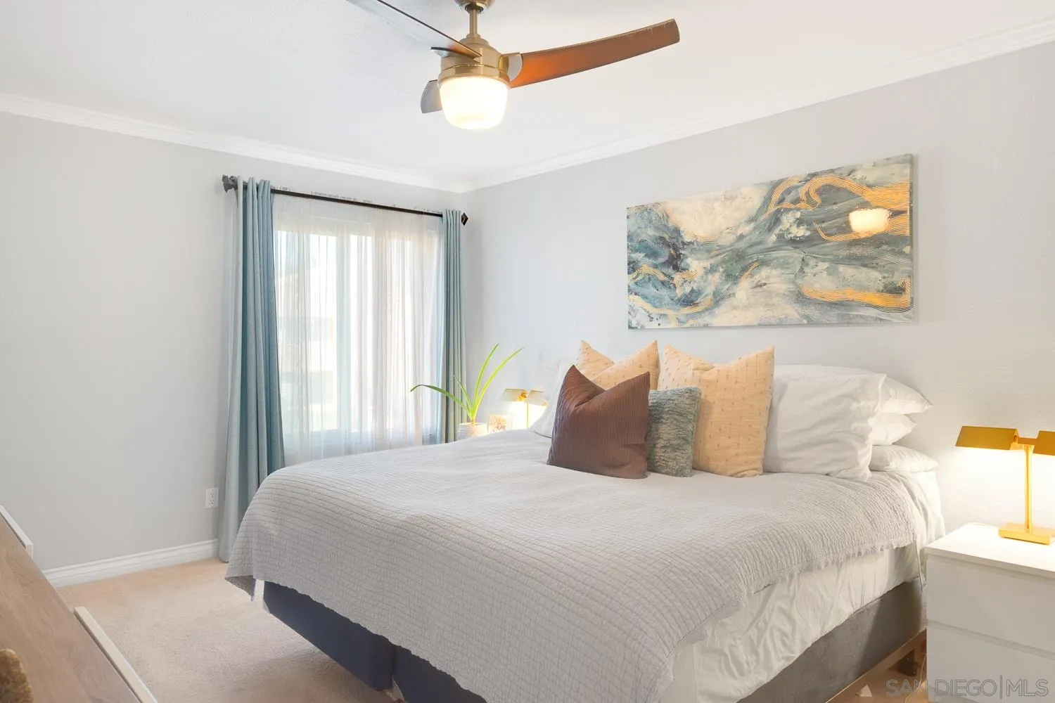 6052 Rancho Mission Road, Unit 408 San Diego, CA 92108 - Photo 9 of 36 a bedroom with a bed and a window