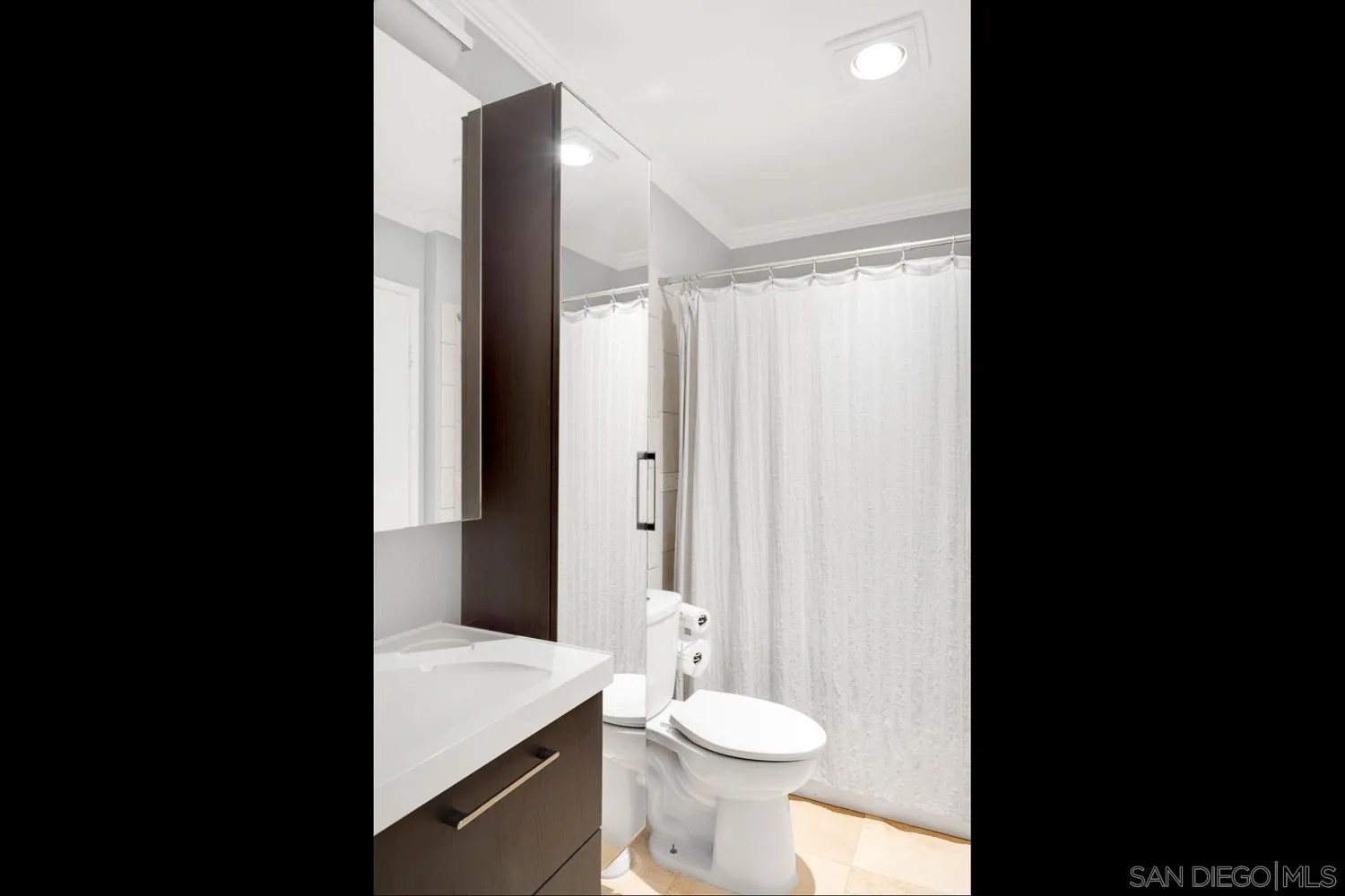 6052 Rancho Mission Road, Unit 408 San Diego, CA 92108 - Photo 10 of 36 a bathroom with a sink and a toilet