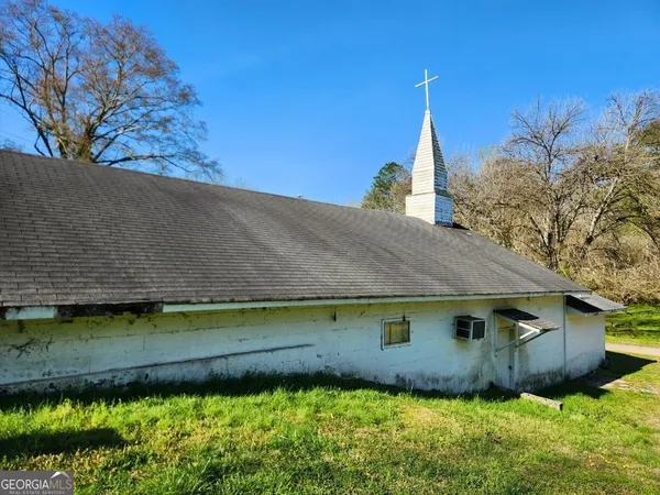a view of a house with a tree
