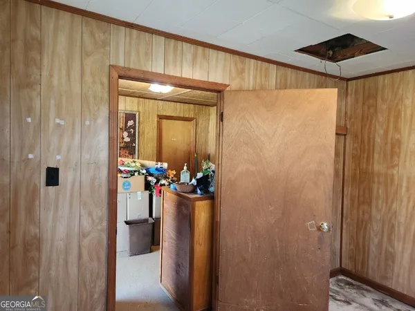 a view of an entryway with a wooden door