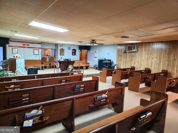 a room with gym equipment and a large window