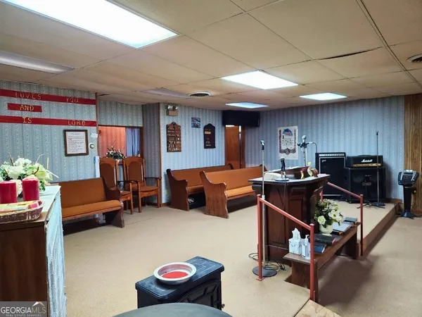 a bedroom with furniture and a window